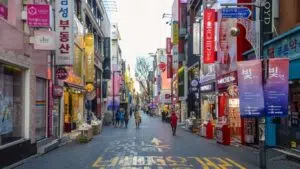 street in south korea flanked by various businesses