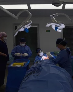 surgeon performing plastic surgery on a patient