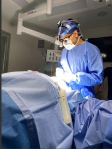 sydney cosmetic and plastic surgeon dr jack zoumaras performing surgery on a patient