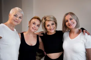 a group of 4 women smiling for the camera